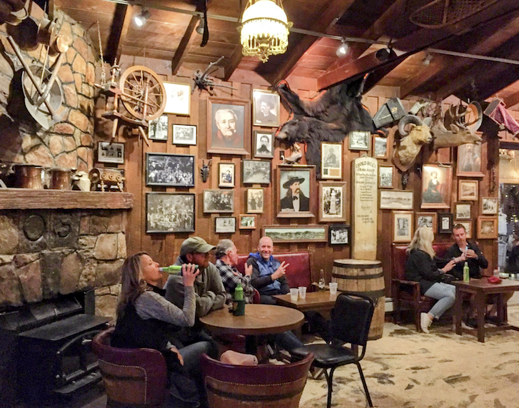 Saloon No. 10 has sawdust on the floor and historic artifacts on the walls.